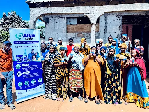 Women participants display locally manufactured AfyaGuard mosquito repellents in Morogoro